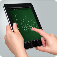 User tapping DigitalPlaybook app on an iPad for Sports Team
